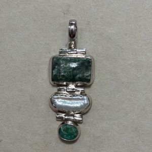 Sterling silver pendant with green and pearl stones.